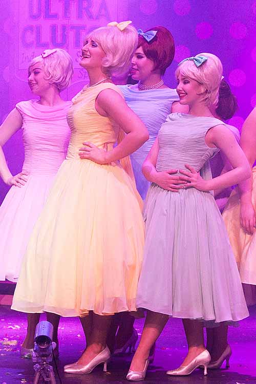 Councilettes in Hairspray wearing pastel coloured 1950s style chiffon dresses