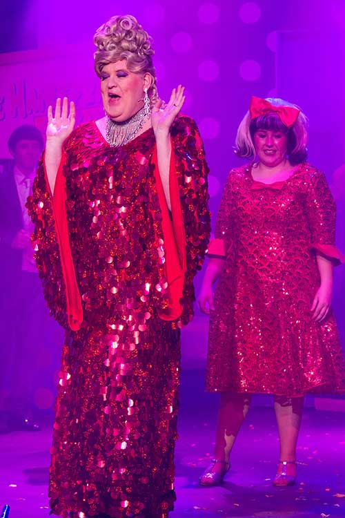 Edna and Tracy in red sequin  finale gowns with matching shoes