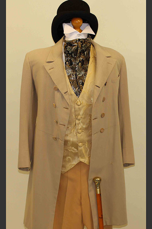 Oliver -Mr Brownlow &apos;s costume.Faun frock coat with gold vest and light  tan period trousers.Top hat and cane